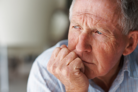 Elderly man lost in thought